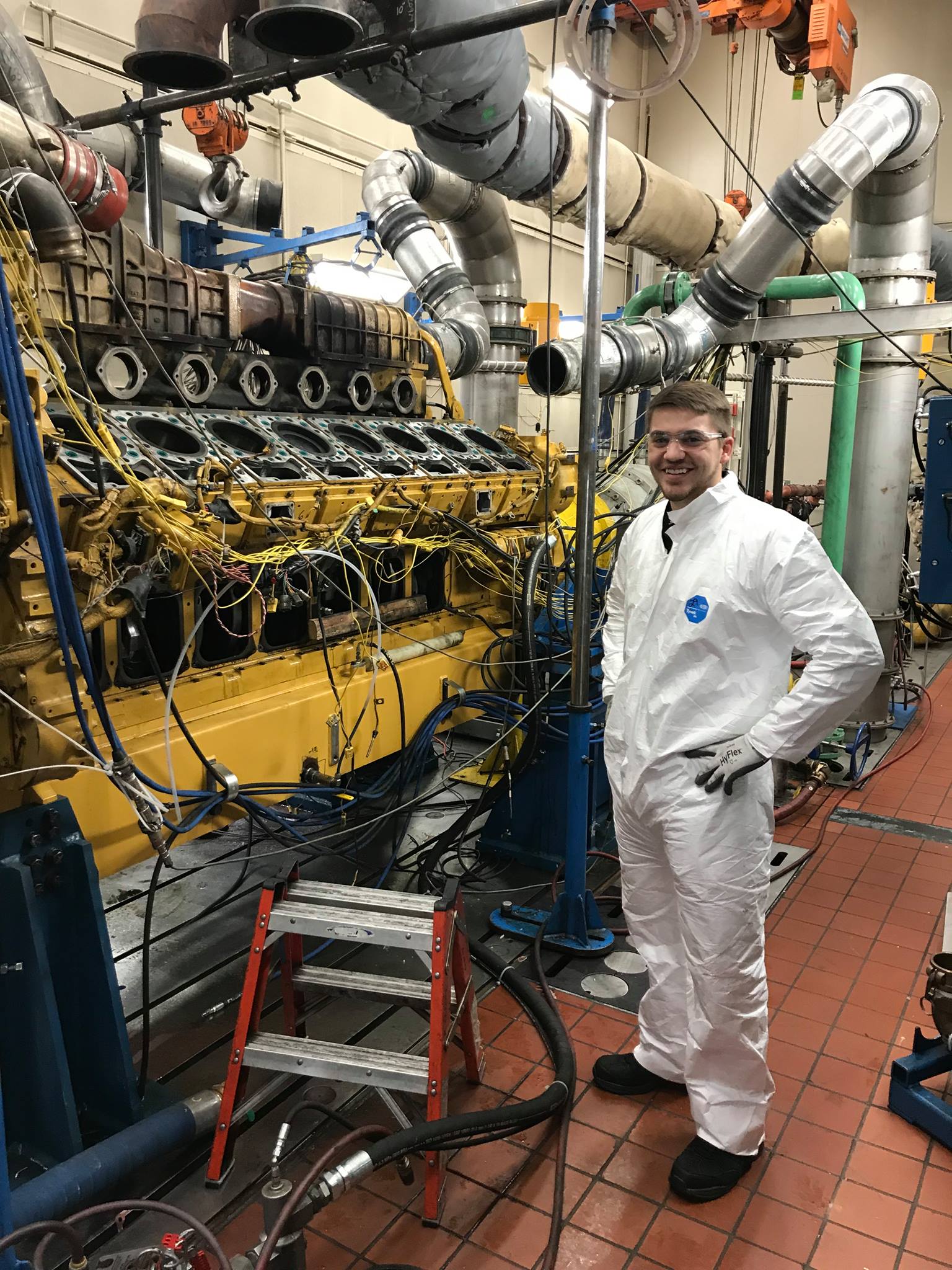 Anthony working on an engine at Caterpillar